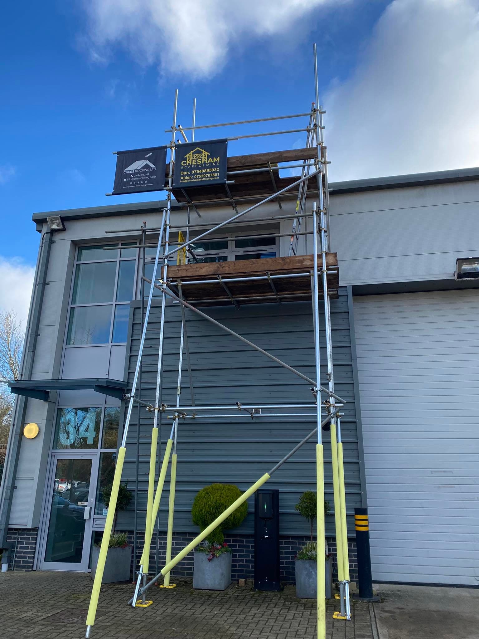 Tower scaffold up the front of a modern commercial unit