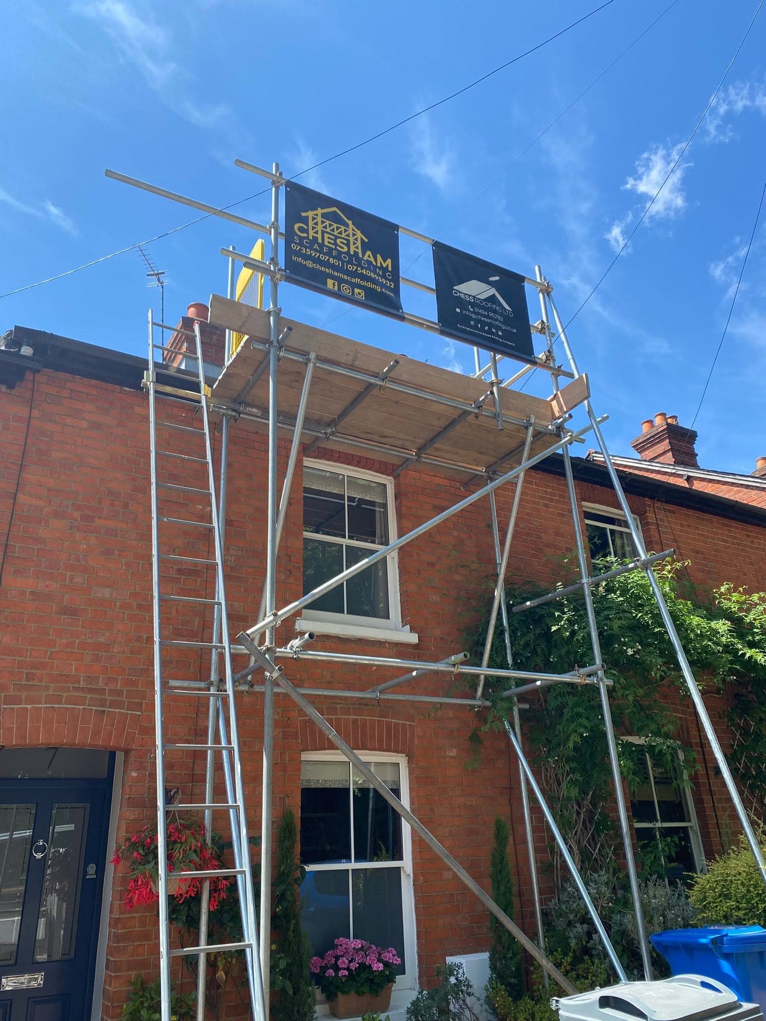 Terrace scaffold with two boards against a blue sky